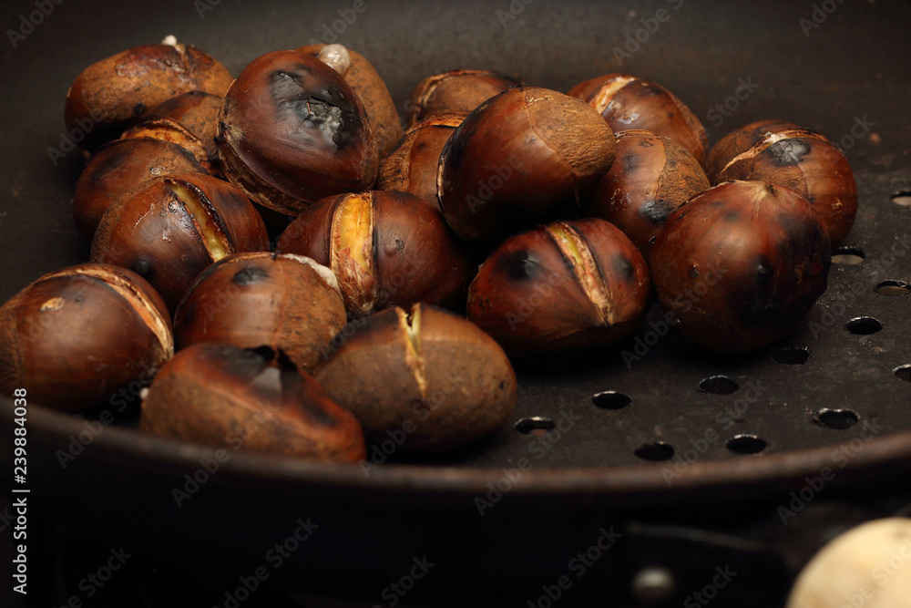 Roasted Chestnuts on a drilled Skillet, closeup view