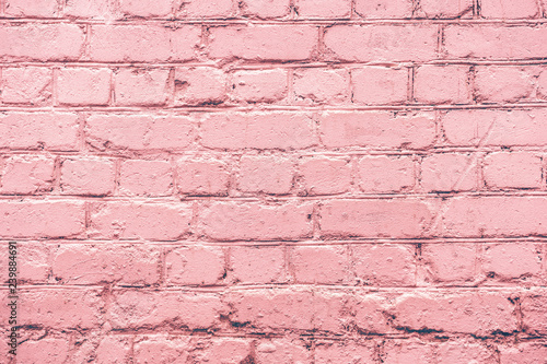 Pink uneven brick wall close-up