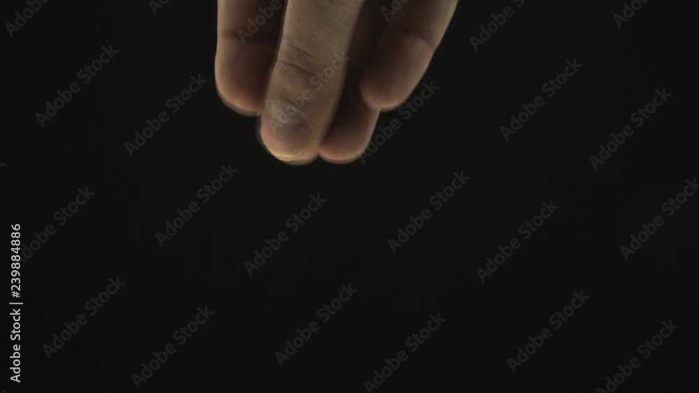 seasoning salt cooking on black background closeup male hand seasoning salt cooking on black background closeup male hand
