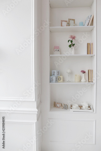 white empty chair and cabinet shelves in luxury apartments with wooden floor