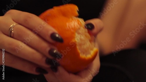 Wallpaper Mural Girl with long nails cleans mandarin. Torontodigital.ca