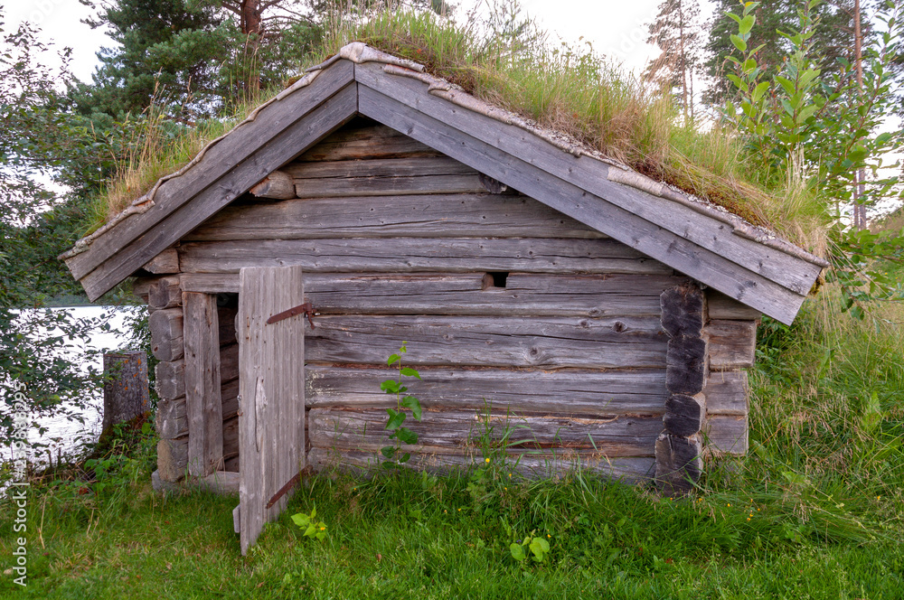 old barn with grass roof old barn with grass roof