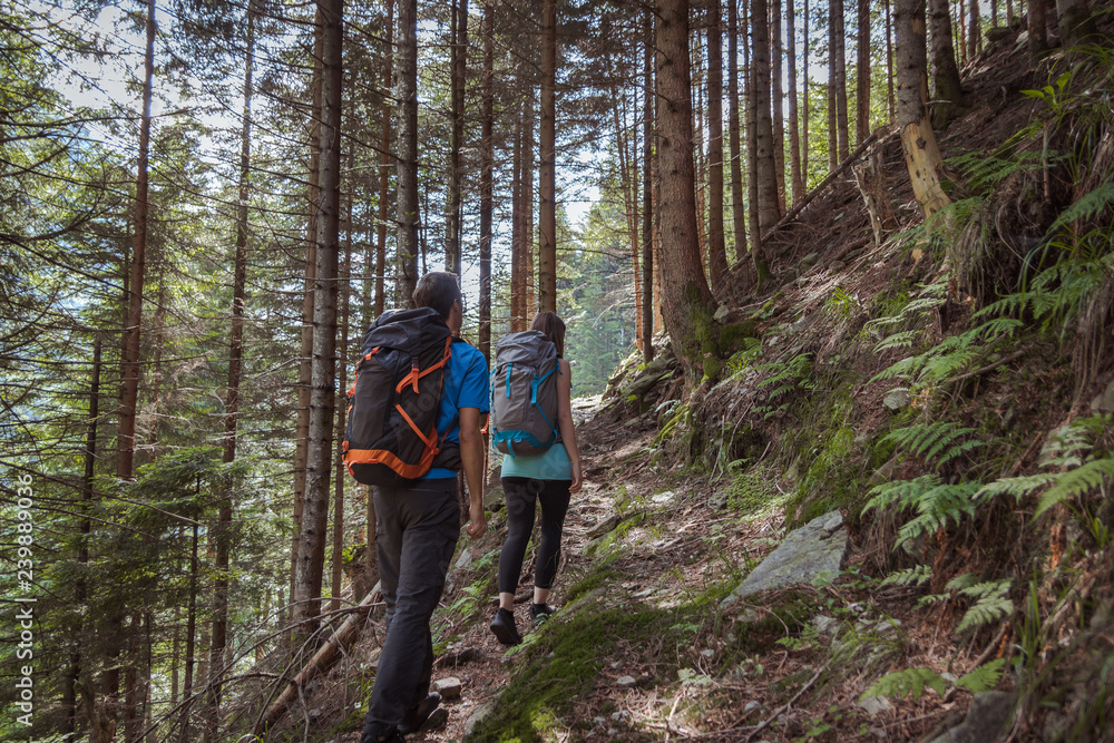 strong couple hiking in the mountains strong couple hiking in the mountains