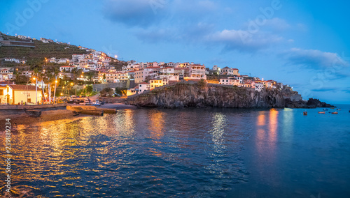 Harbor and fishing village Camara de Lobos at twilight time, Madeira island, Portugal