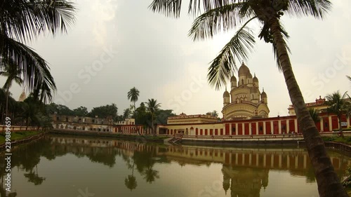 Kali Ma temple with reflaction in pond palms cloudy day Kolkata