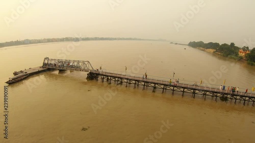 People on pier on river Hooghly Hindu temple on bank Ramakrishna mission sunset delta of Ganges Kolkata
