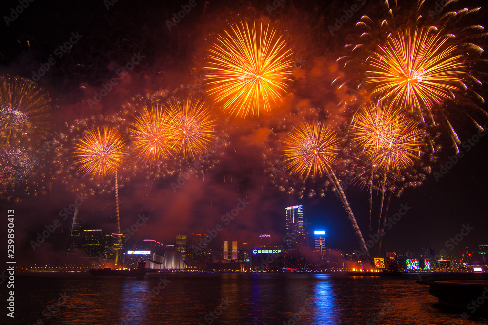 Fototapeta premium Hong Kong - 01 Februar, 2014: Fireworks at the celebration of the Chinese New Year . Viewed from Hong Kong Island on Kowloon and Victoria Harbor
