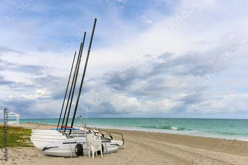 Sailing catamarans without sails on the beach, Cuba, Varadero