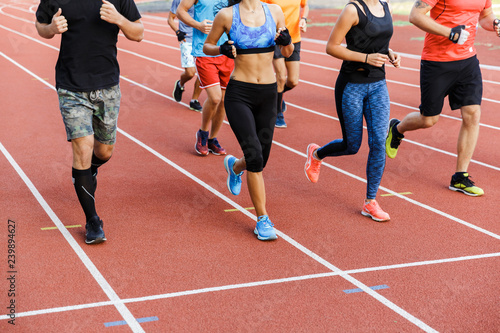 Cropped image of a group of sport people in sportswear