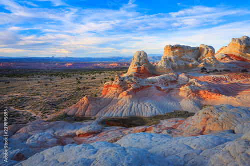 The last light of day hits the colorful landscape of White Pocket, Arizona in the Vermilion Cliffs National Monument