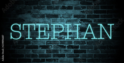 Obraz na plátně first name Stephan in blue neon on brick wall