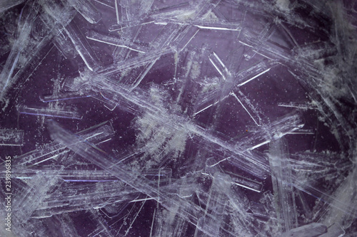 Fotografija The process of growing potassium nitrate crystals, the crystals are in the form of hexagonal needles