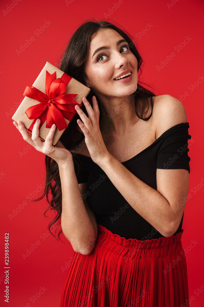 Happy young woman wearing a dress standing Happy young woman wearing a dress standing