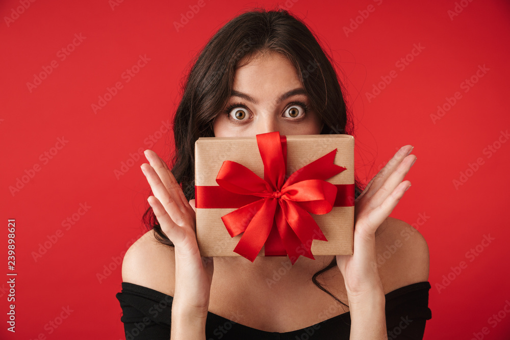 Naklejka premium Happy young woman wearing a dress standing