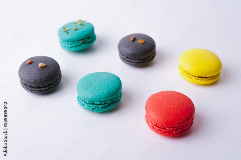 Fototapeta premium Sweet and colorful macaroons or macarons on white background