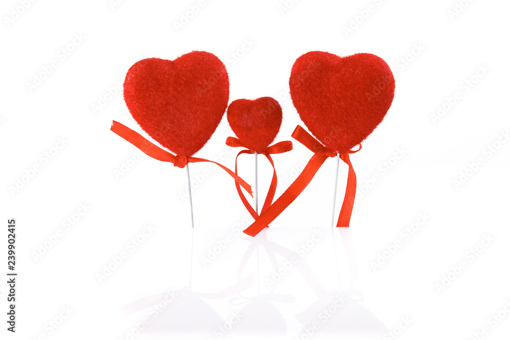 Valentine's Day. Card, three red hearts family, isolated on a white background with reflection.