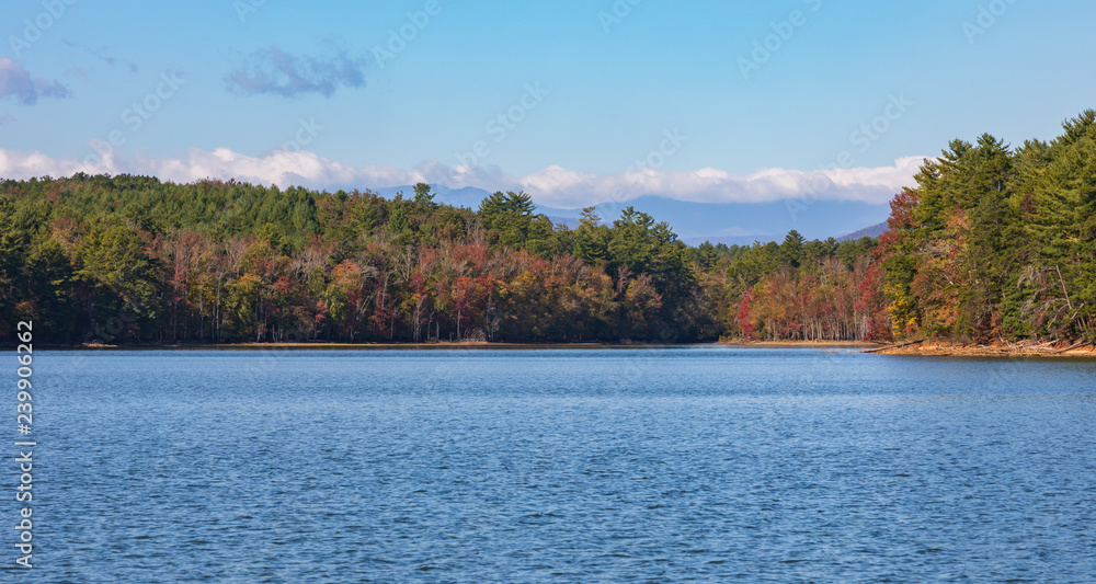 Blue Lake with early autumn forest in distance. Background. Blue Lake with early autumn forest in distance. Background.