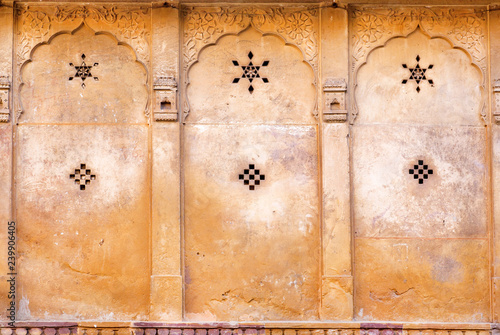 Patterns with stars on wall of historical house in Rajasthan, India.