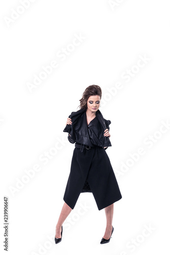 Fashion model wearing trendy black coat