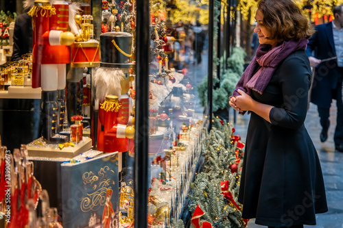 Woman doing Christmas shopping in luxury arcade, London photo