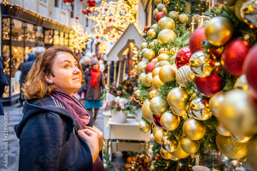 Woman doing Christmas shopping in luxury arcade, London photo