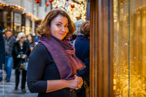 Woman doing Christmas shopping in luxury arcade, London photo