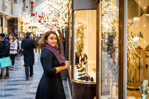 Woman doing Christmas shopping in luxury arcade, London photo