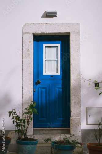 Small traditional blue door of the house in Lissabon, Lisboa Portugal