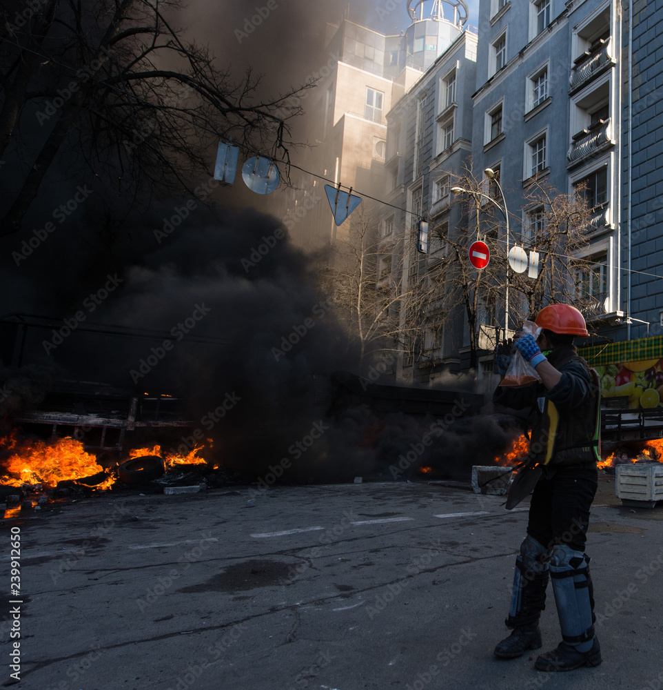 Street riots, fire in the city, protests