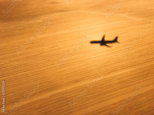 Airplane shadow on the background of the field