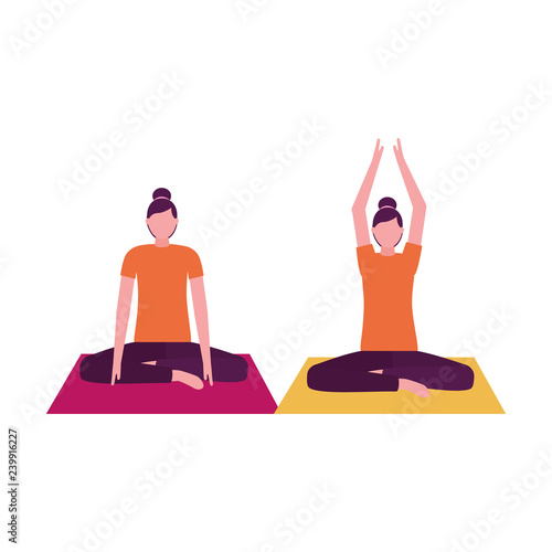 women practicing yoga on mat