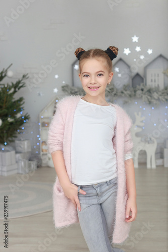 portrait of smiling little girl in christmas decorations