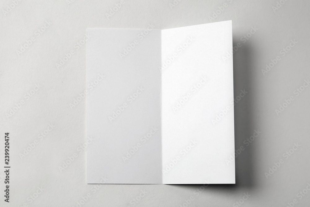 Blank brochure on white background, above view. Mock up for design Blank brochure on white background, above view. Mock up for design
