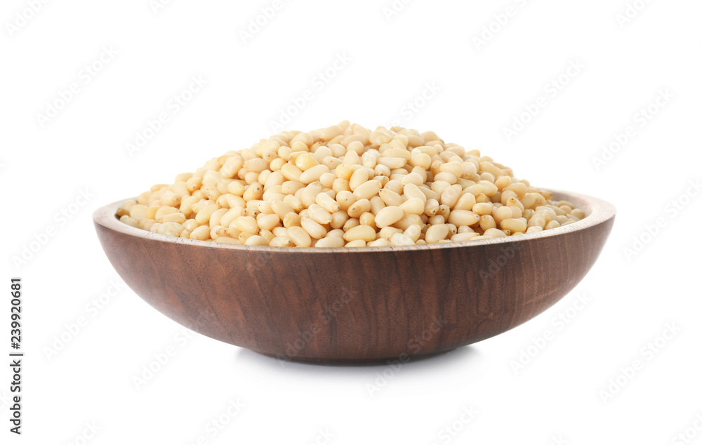 Plate with pine nuts on white background Plate with pine nuts on white background