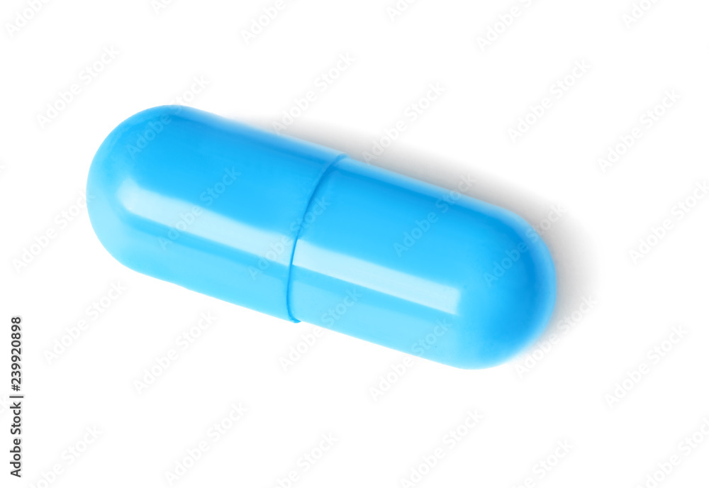 Pill on white background. Medical care and treatment