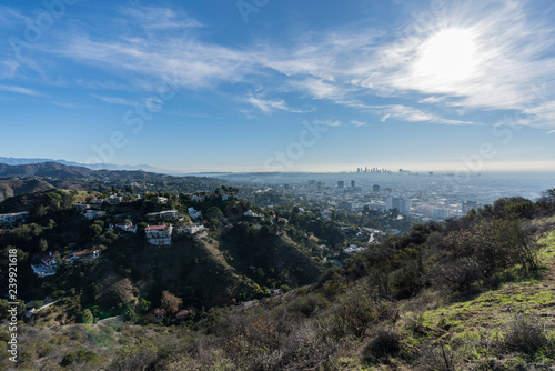 Clear morning view on canyon homes, Hollywood and downtown Los Angeles from hiking trail at Runyon Canyon Park. 