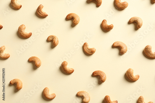 Tasty cashew nuts on light background, flat lay