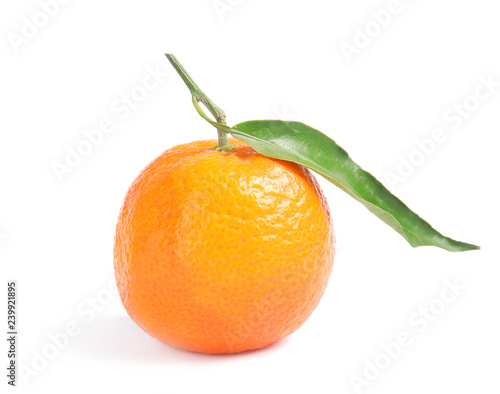 Tasty ripe tangerine with leaf on white background