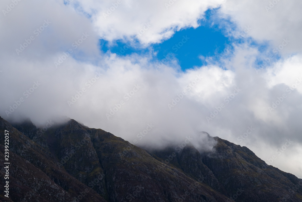 Clouds cover mountain tops at Glencoe, Scotland