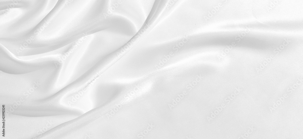 The texture of the satin fabric of white color for the background