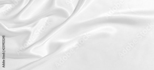 The texture of the satin fabric of white color for the background