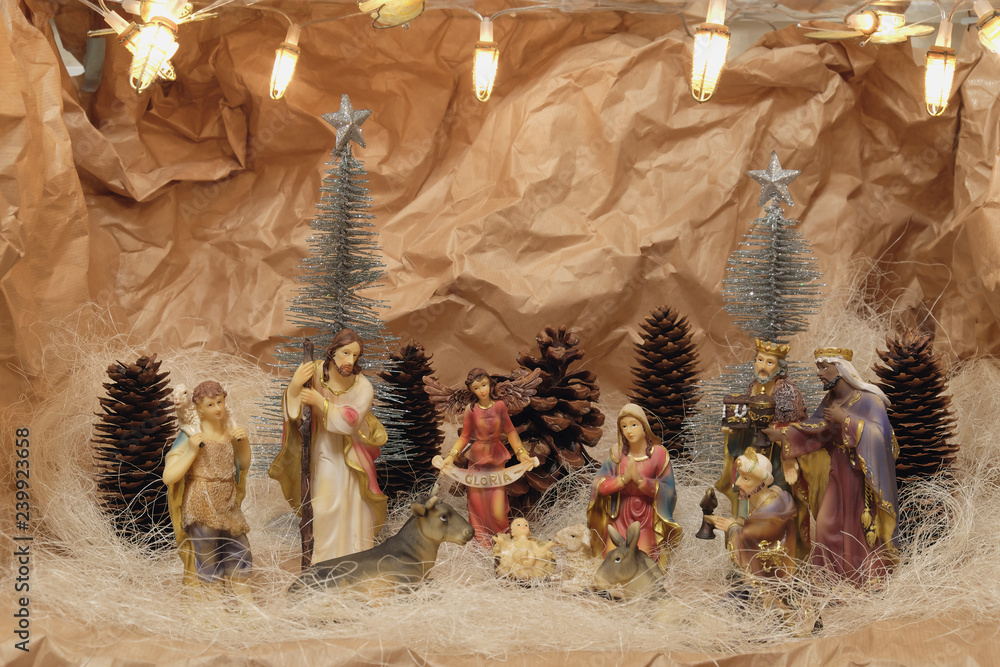 Nativity scene with colorful figurines of holy Mary Joseph Three Kings