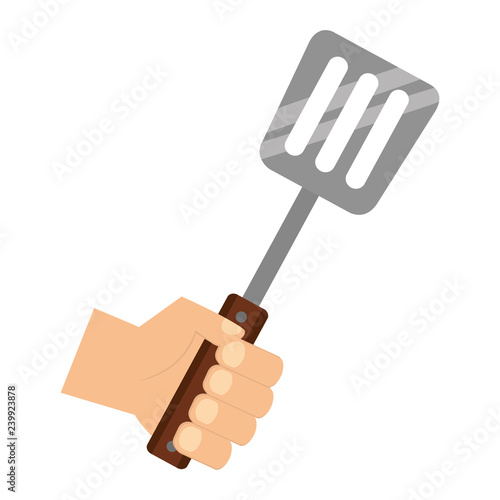 hand holding spatula