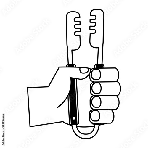 hand holding tongs utensil
