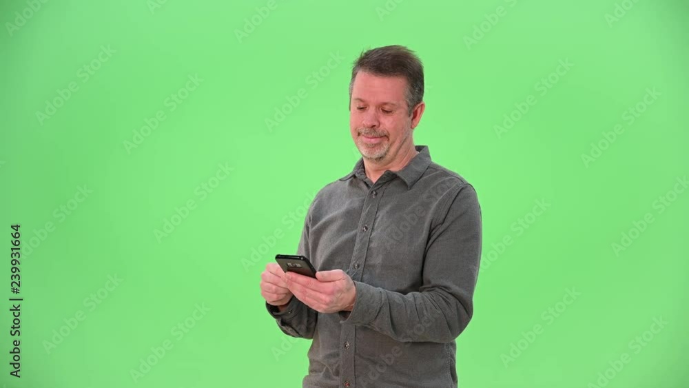 One man interacting with cellphone like he's using a dating service on green screen One man interacting with cellphone like he's using a dating service on green screen