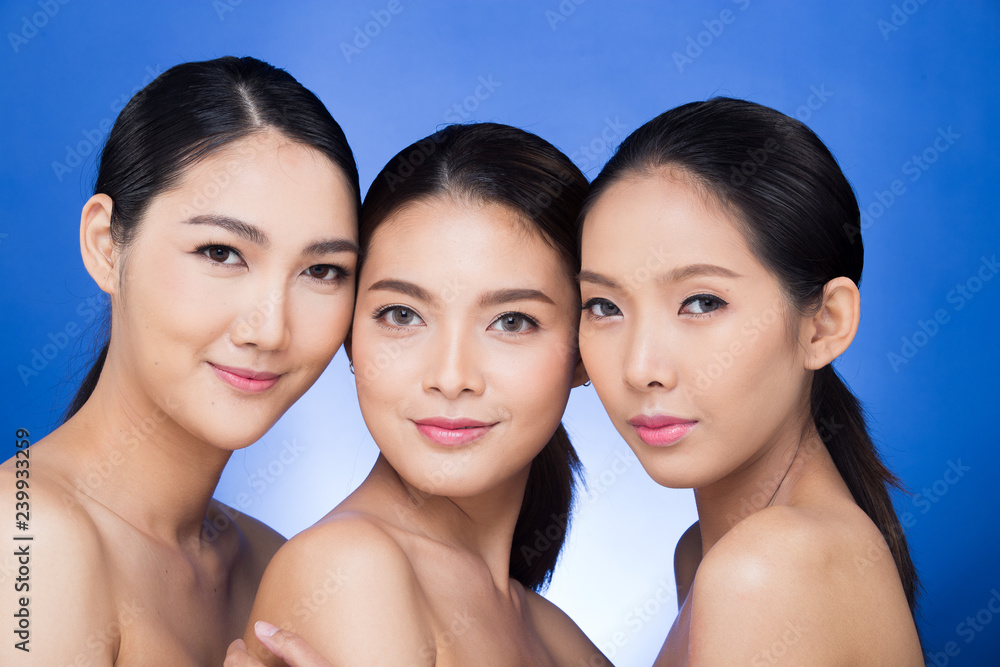 Group Three Beautiful Asian Long straight black hair tan skin women portrait in open naked shoulder, fashion make up, studio lighting dark background Empty copy space, concept bath skincare product Group Three Beautiful Asian Long straight black hair tan skin women portrait in open naked shoulder, fashion make up, studio lighting dark background Empty copy space, concept bath skincare product