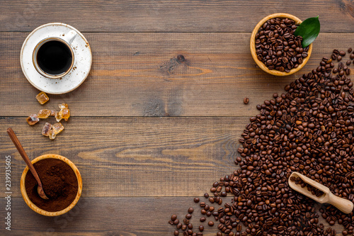 coffee bean and cup of americano on wooden table background top view mockup