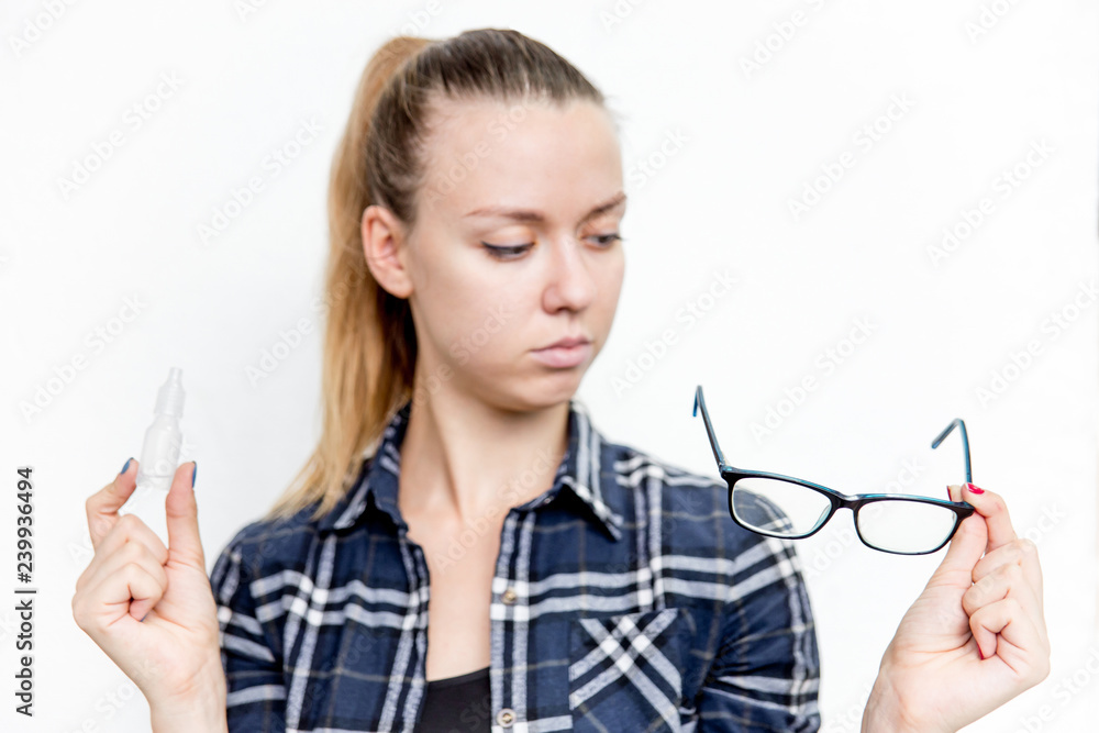 Young woman with bad eyesight with glasses and contact lenses Young woman with bad eyesight with glasses and contact lenses