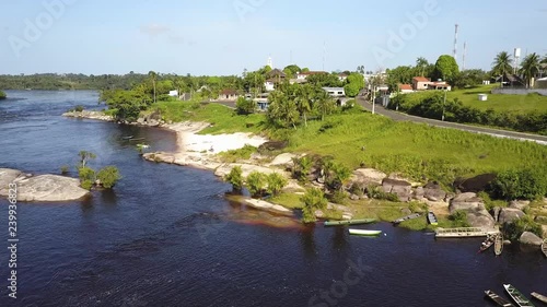 Aerial Drone Tracking Shot Following a Section of the Negro River that is Full of Fishing Boats and Canoes. photo