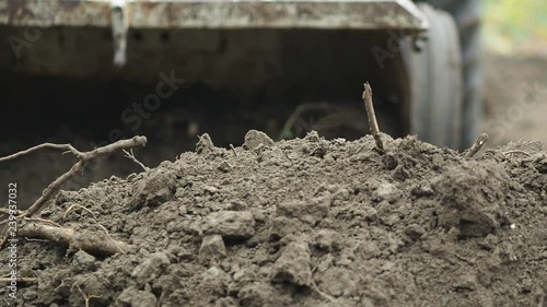 Wallpaper Mural Soil being moved by a tractor driven by a a small scale, organic farmer  in Johnston, Rhode Island Torontodigital.ca